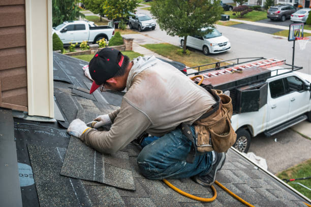 Professional Roofing technician working in Fall Creek, OR